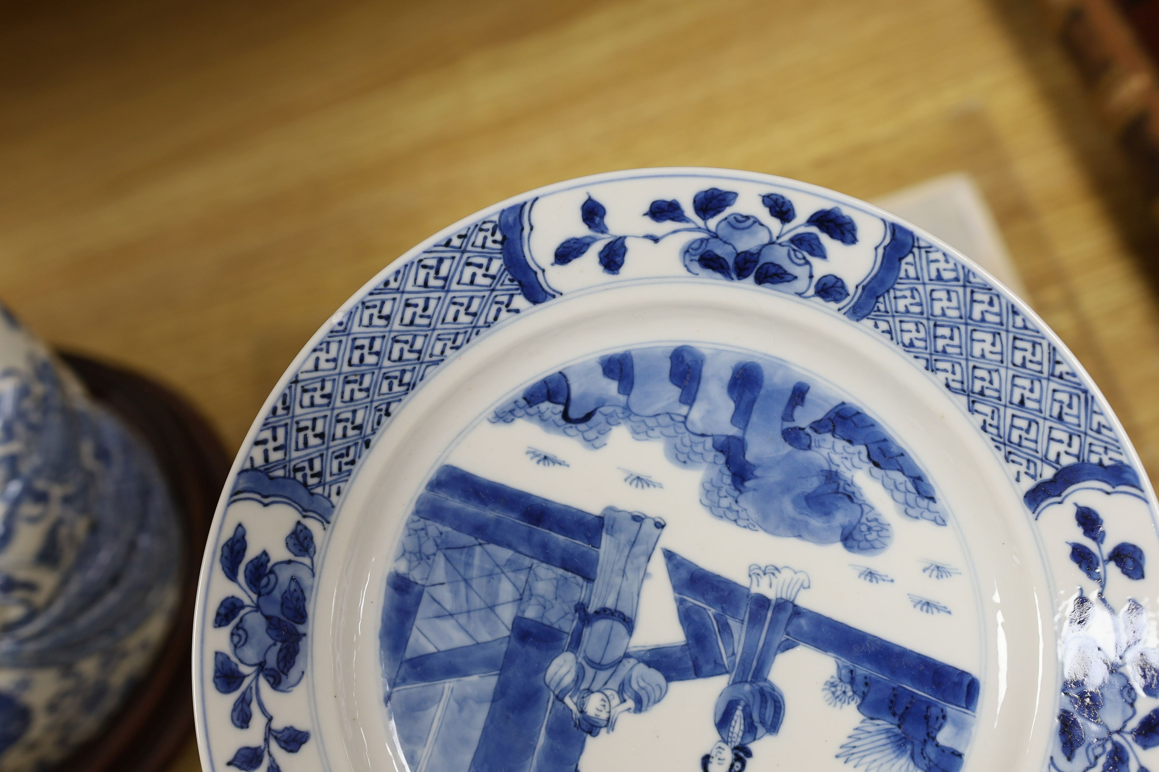 Two Chinese blue and white plates, Kangxi period, one with Kangxi mark the other a Chenghua mark, 21 cms diameter